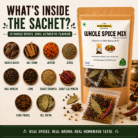 Whole spices inside Phunti Masale Whole Spice Mix sachet including cinnamon, cardamom, cumin, cloves and bay leaf